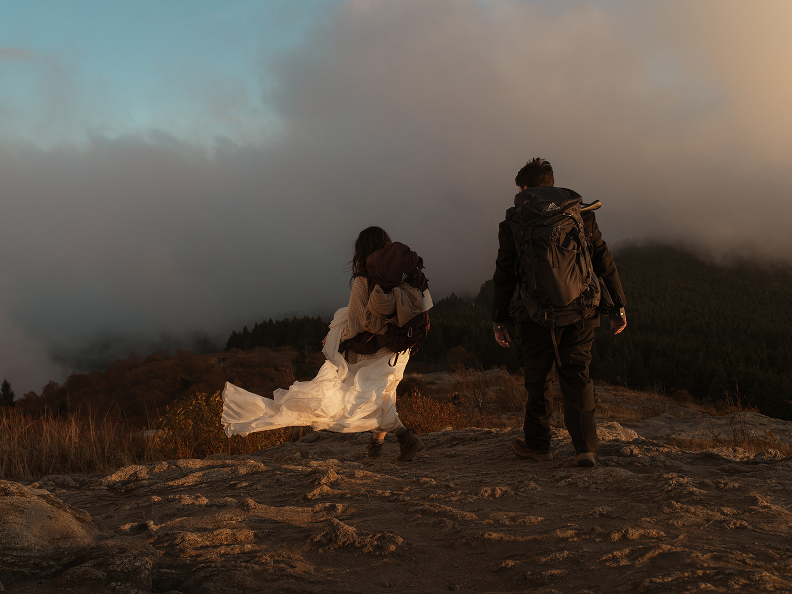 Couple hiking the blue ridge mountains to elope